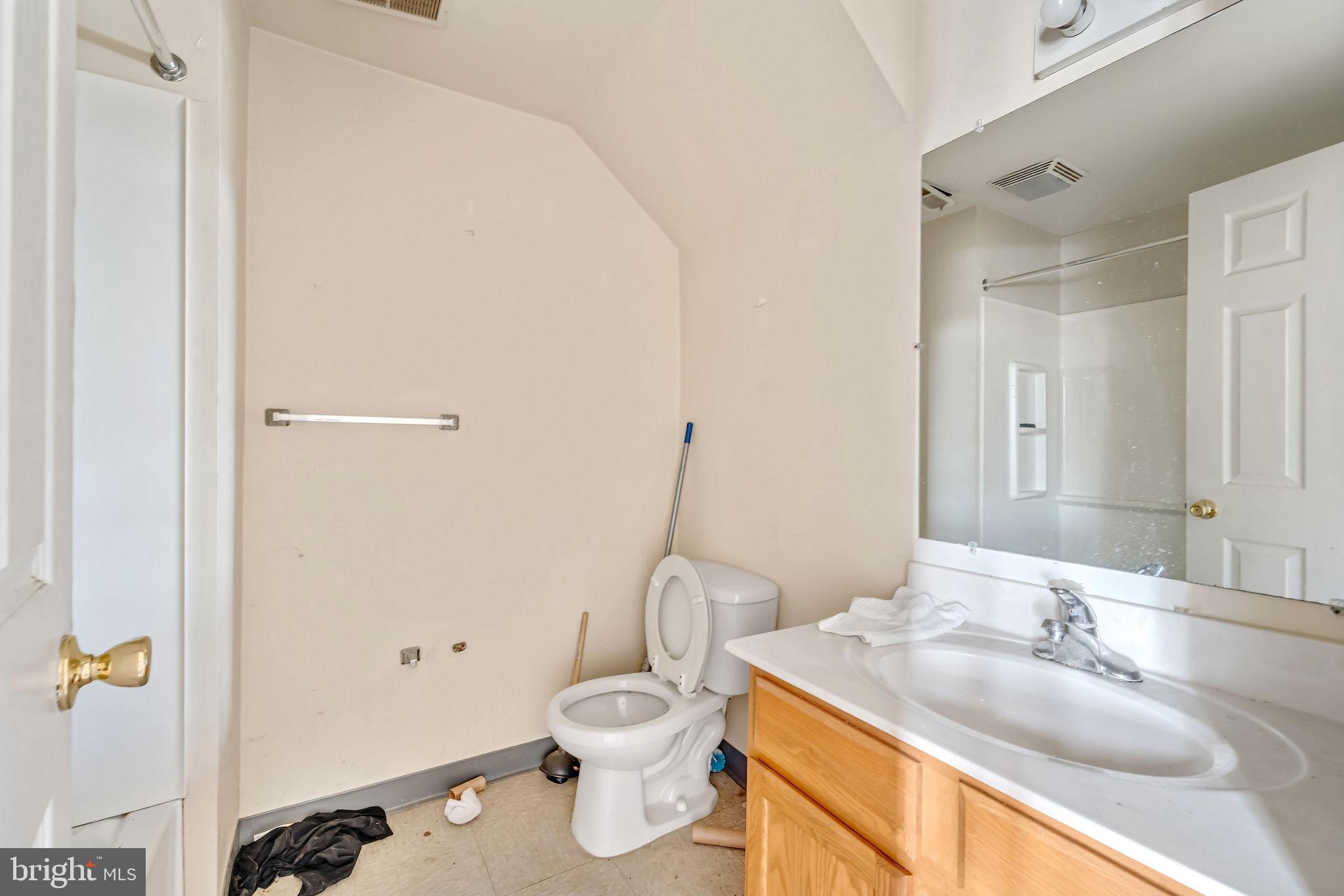 139 State Street Camden, NJ 08102 - Photo 29 of 29 a bathroom with a granite countertop sink toilet and shower