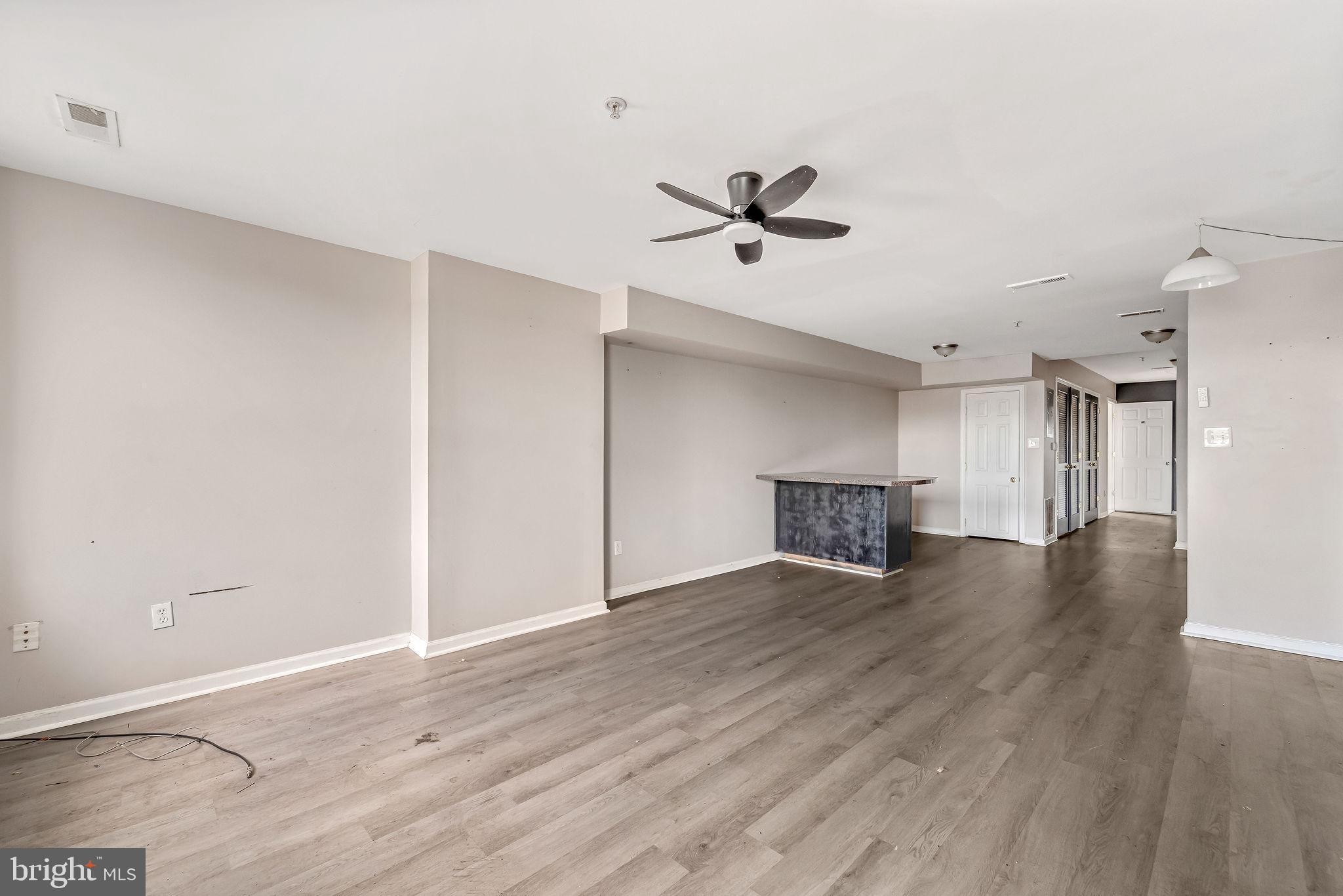 139 State Street Camden, NJ 08102 - Photo 9 of 29 a view of empty room with wooden floor and ceiling fan