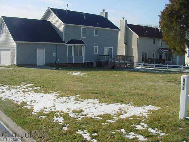 3207 Spring Mill Road Greensboro, NC 27406 - Photo 2 of 8 Exterior Back. Hugh back yard with deck
