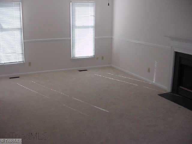 3207 Spring Mill Road Greensboro, NC 27406 - Photo 7 of 8 Living Room. Living Room with Fireplace and fresh paint