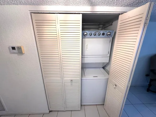 a view of a storage & utility room with a window