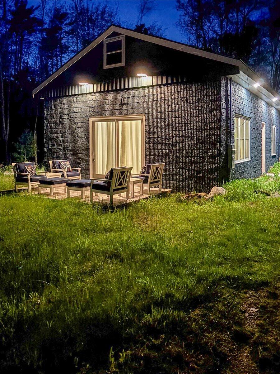 70 Pinkham Road Damariscotta, ME 04543 - Photo 4 of 44 Recessed exterior lighting at dusk
