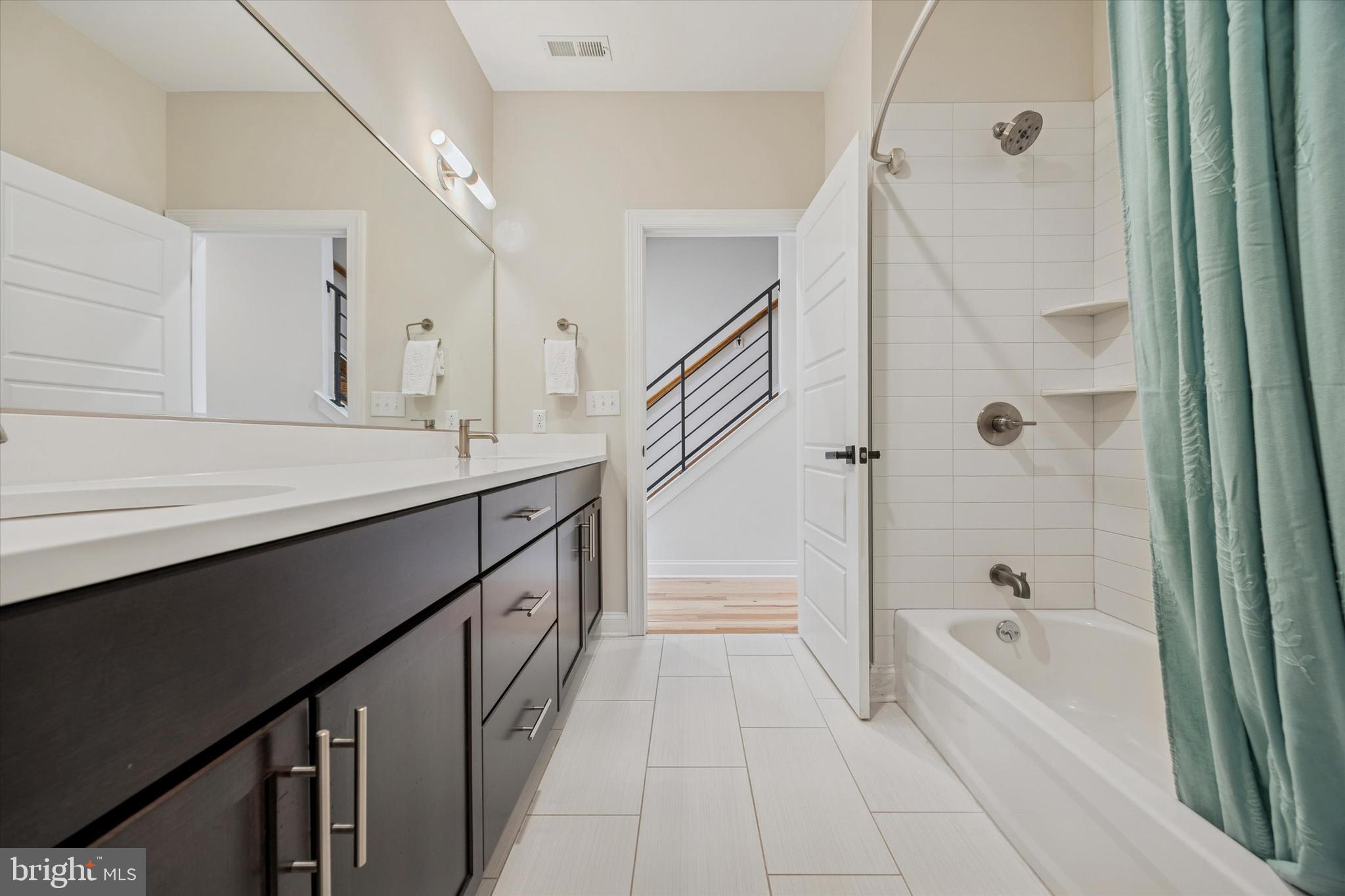 152 Carson Street Philadelphia, PA 19127 - Photo 13 of 33 a spacious bathroom with a tub sink shower and mirror
