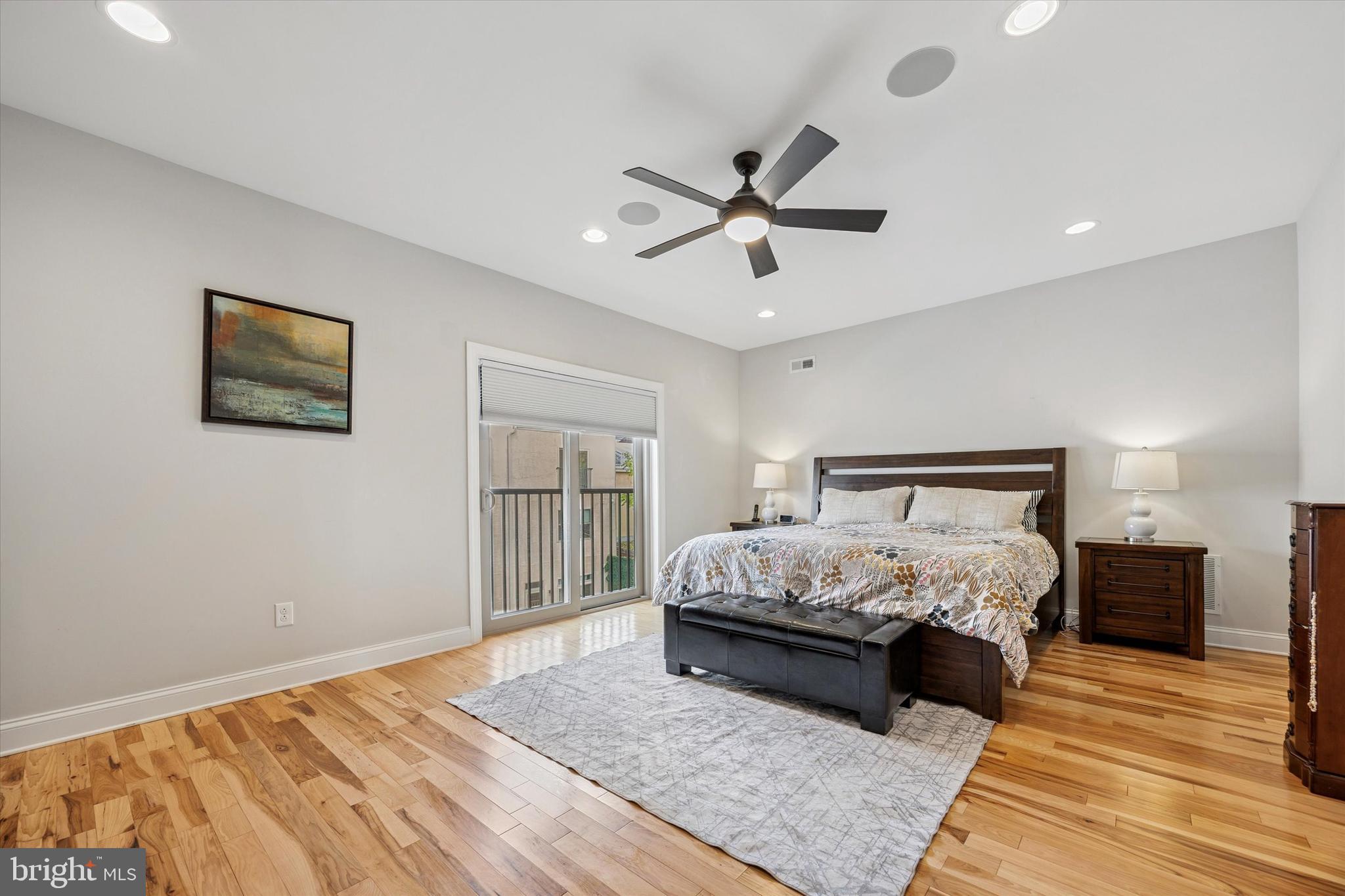 152 Carson Street Philadelphia, PA 19127 - Photo 15 of 33 a bedroom with a large bed and a chandelier