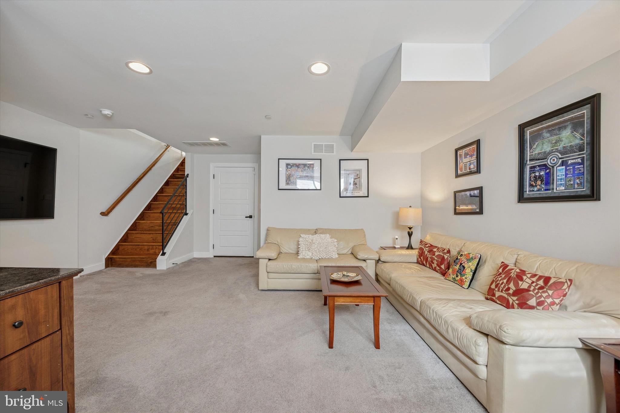 152 Carson Street Philadelphia, PA 19127 - Photo 21 of 33 a living room with furniture and a flat screen tv