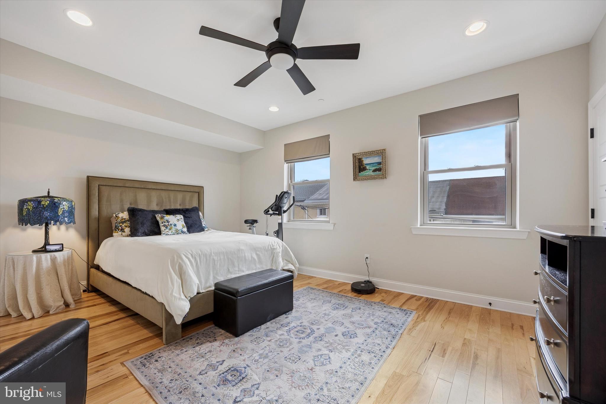 152 Carson Street Philadelphia, PA 19127 - Photo 9 of 33 a bedroom with a bed and wooden floor