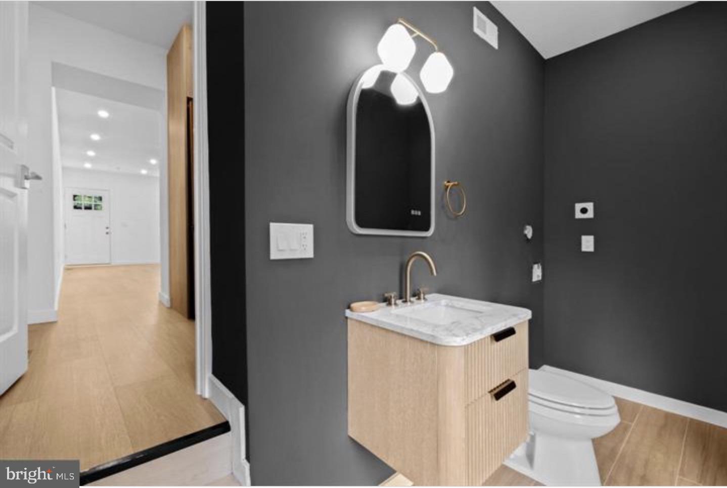 2215 Mutter Street Philadelphia, PA 19133 - Photo 12 of 21 a bathroom with a toilet sink and mirror