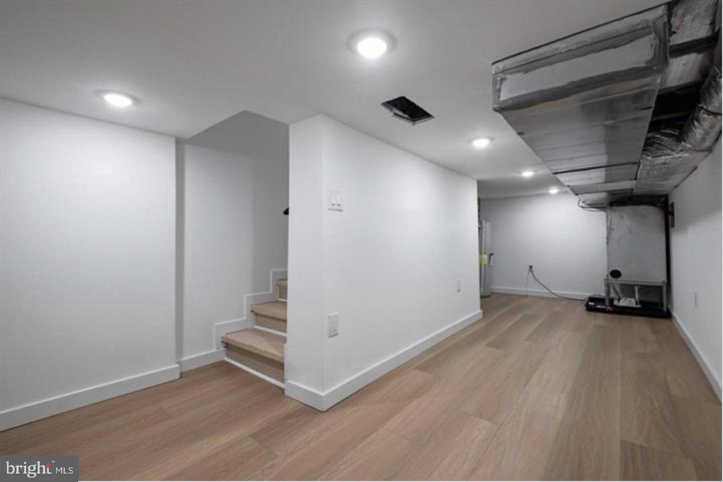2215 Mutter Street Philadelphia, PA 19133 - Photo 14 of 21 an empty room with staircase and windows