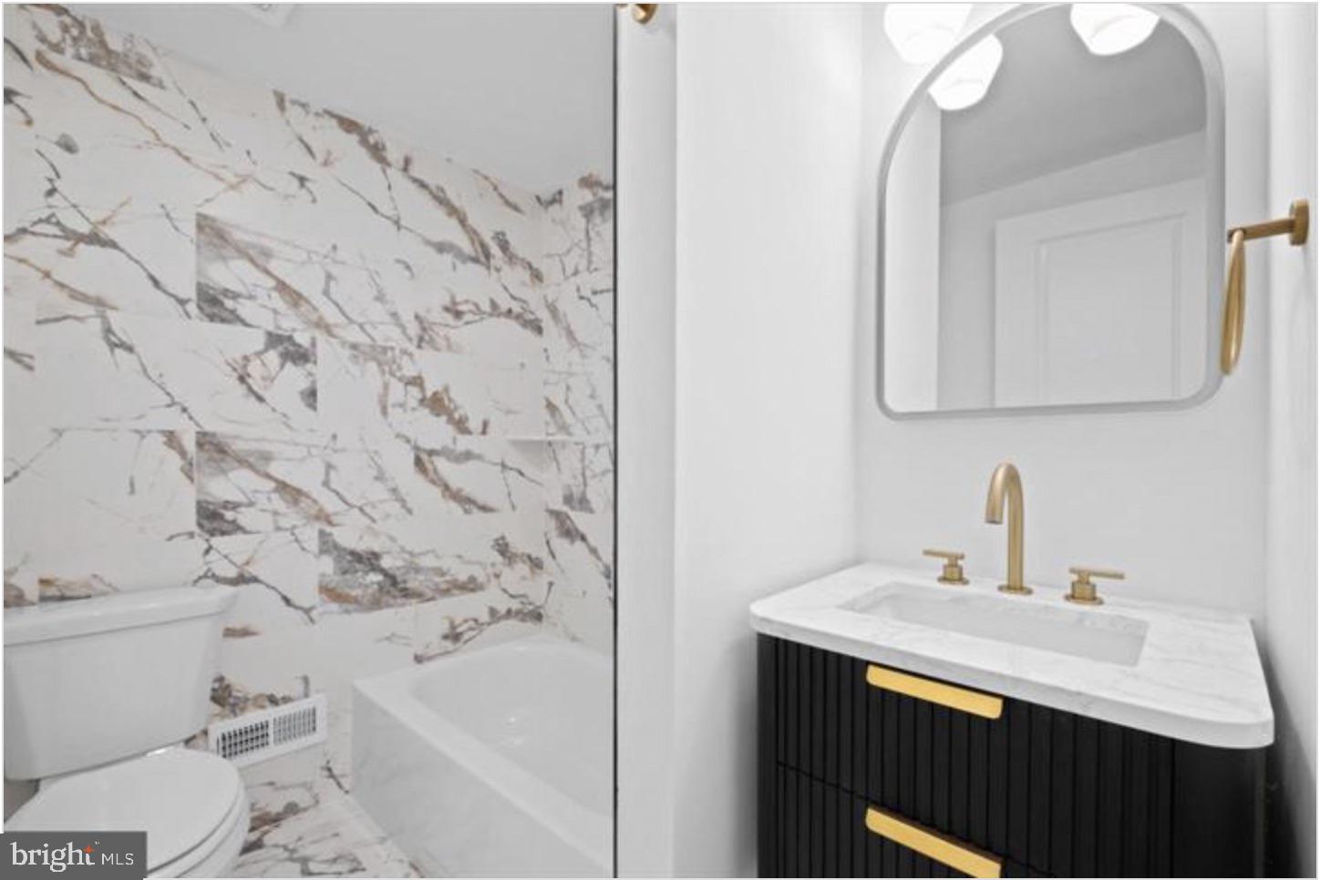 2215 Mutter Street Philadelphia, PA 19133 - Photo 21 of 21 a bathroom with a sink and a mirror