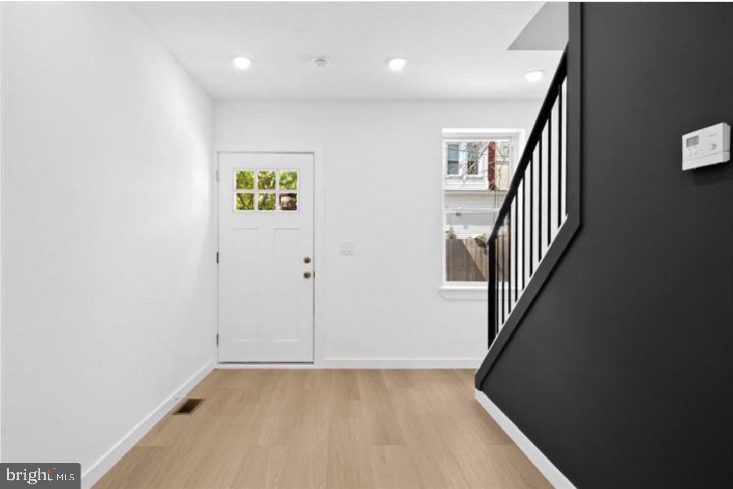 2215 Mutter Street Philadelphia, PA 19133 - Photo 3 of 21 wooden floor in an empty room with a window