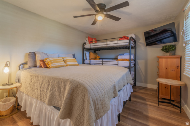860 South Village Road, Unit Y8 St. George, UT 84770 - Photo 8 of 29 Bedroom featuring wood finished floors and a ceiling fan