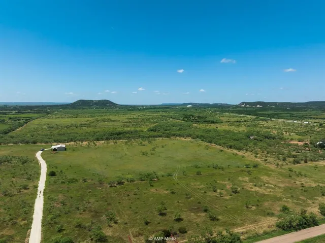 a view of an ocean and yard