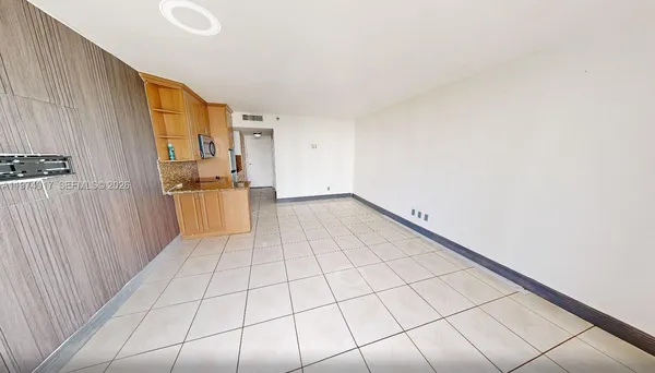 a kitchen with granite countertop a stove a sink and a microwave