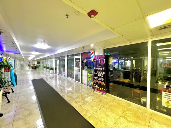 a living room with lots of furniture and a dining table