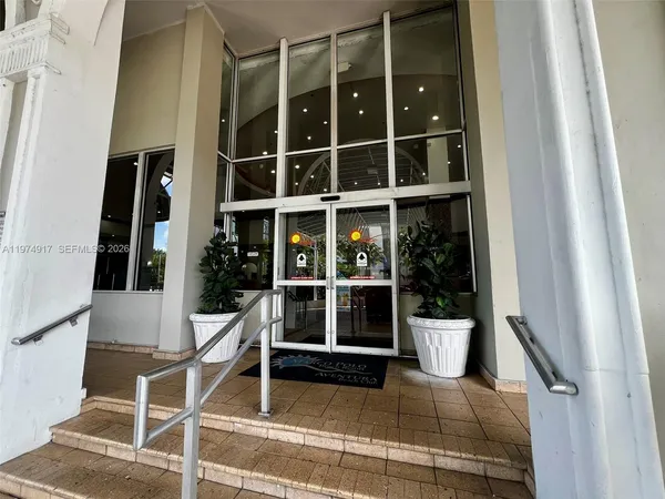 a lobby with furniture and a large window