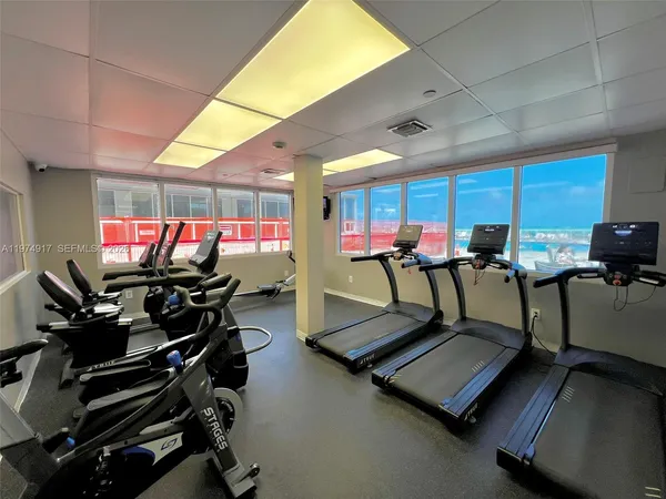 a bathroom with a sink a toilet and a shower