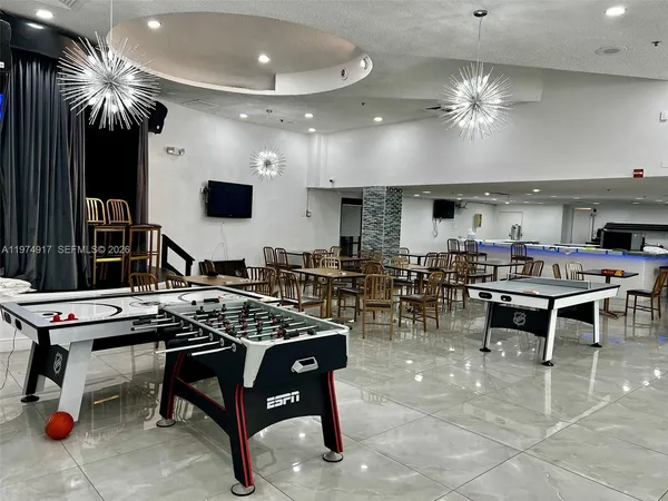 a view of a chairs and tables in patio