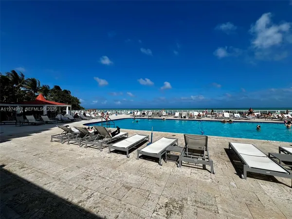 a view of a swimming pool and an outdoor space