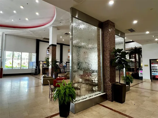 a view of a hallway with retail shop