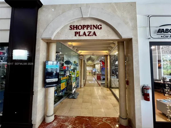 a view of a hallway with a chandelier