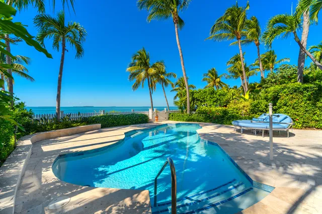 a kitchen with stainless steel appliances a sink and cabinets
