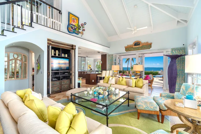 a kitchen with white cabinets and refrigerator