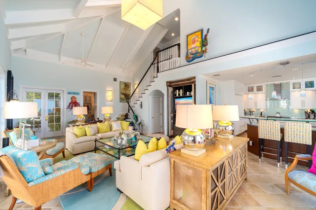 a dining room with a table and chairs