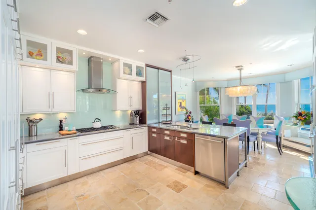 a very nice looking dining room with kitchen island furniture and a large window