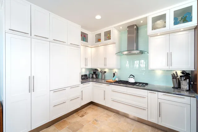 a bedroom with bed and wooden floor