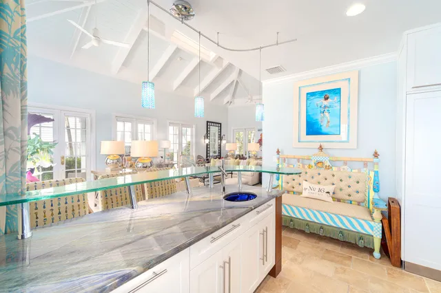 a bedroom with furniture and a flat screen tv