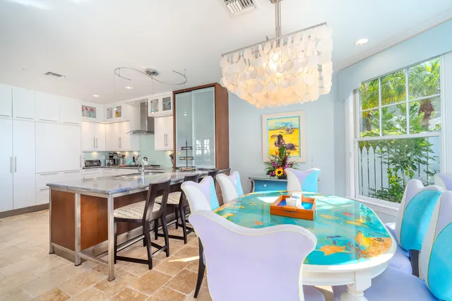 a view of a swimming pool with a table and chairs