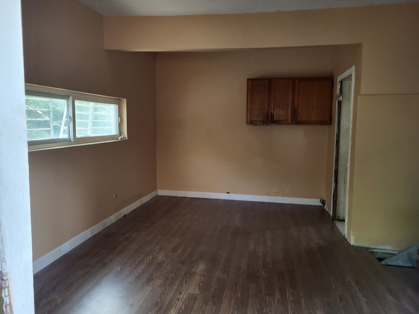 911 West Marquette Road Chicago, IL 60621 - Photo 12 of 13 an empty room with wooden floor and windows
