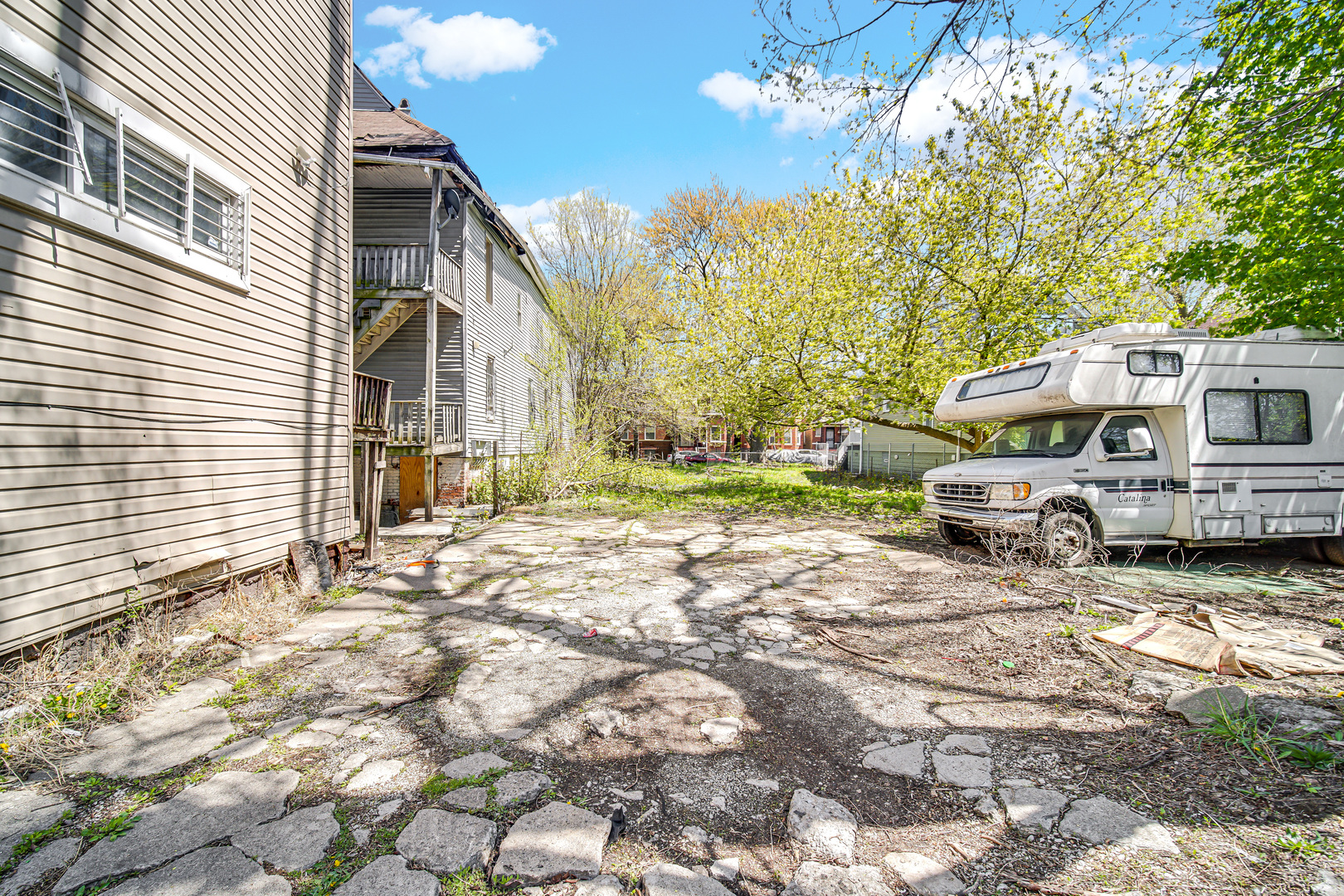 911 West Marquette Road Chicago, IL 60621 - Photo 2 of 13 a view of a house with a large tree in front of it
