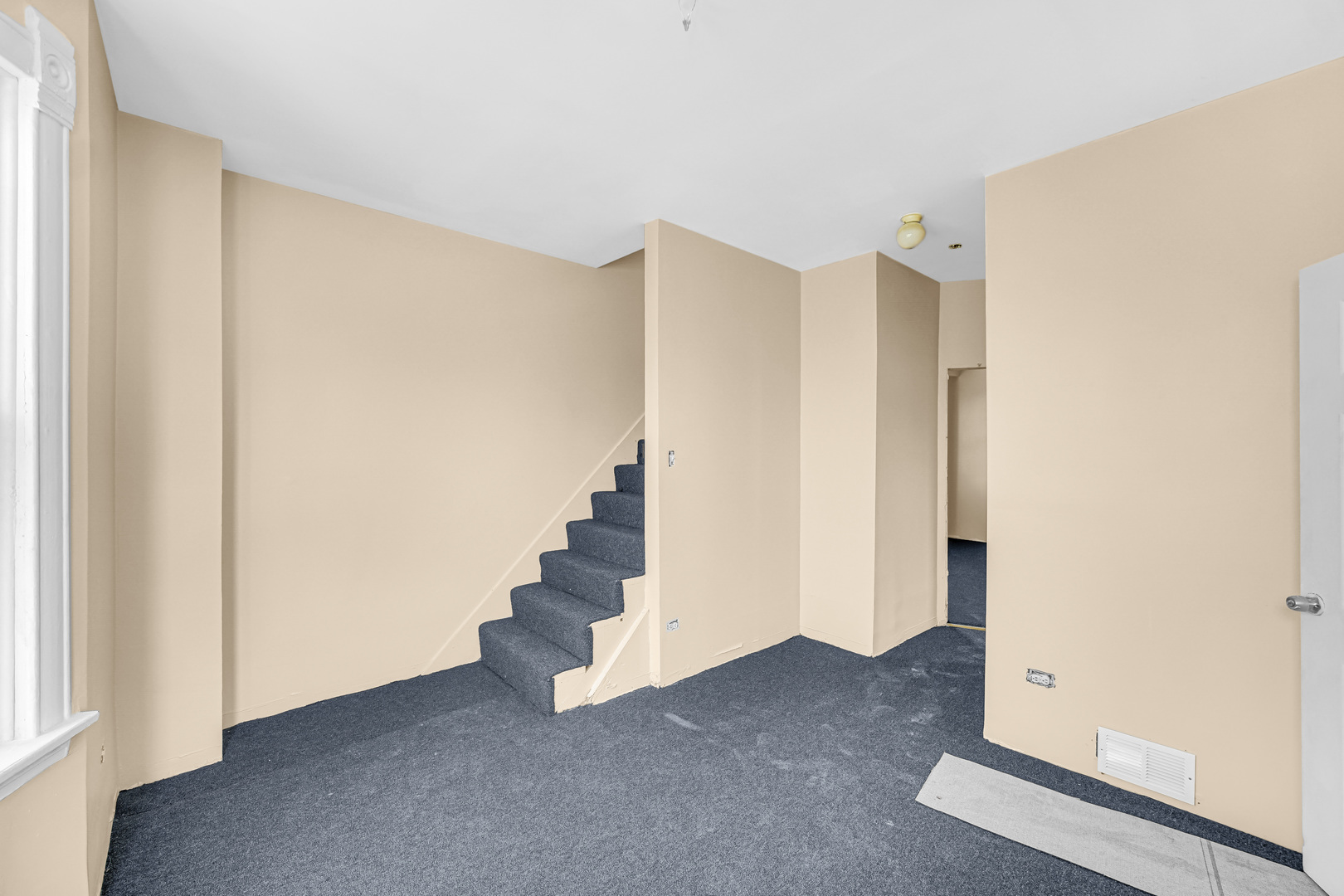 911 West Marquette Road Chicago, IL 60621 - Photo 5 of 13 a view of an empty room with stairs