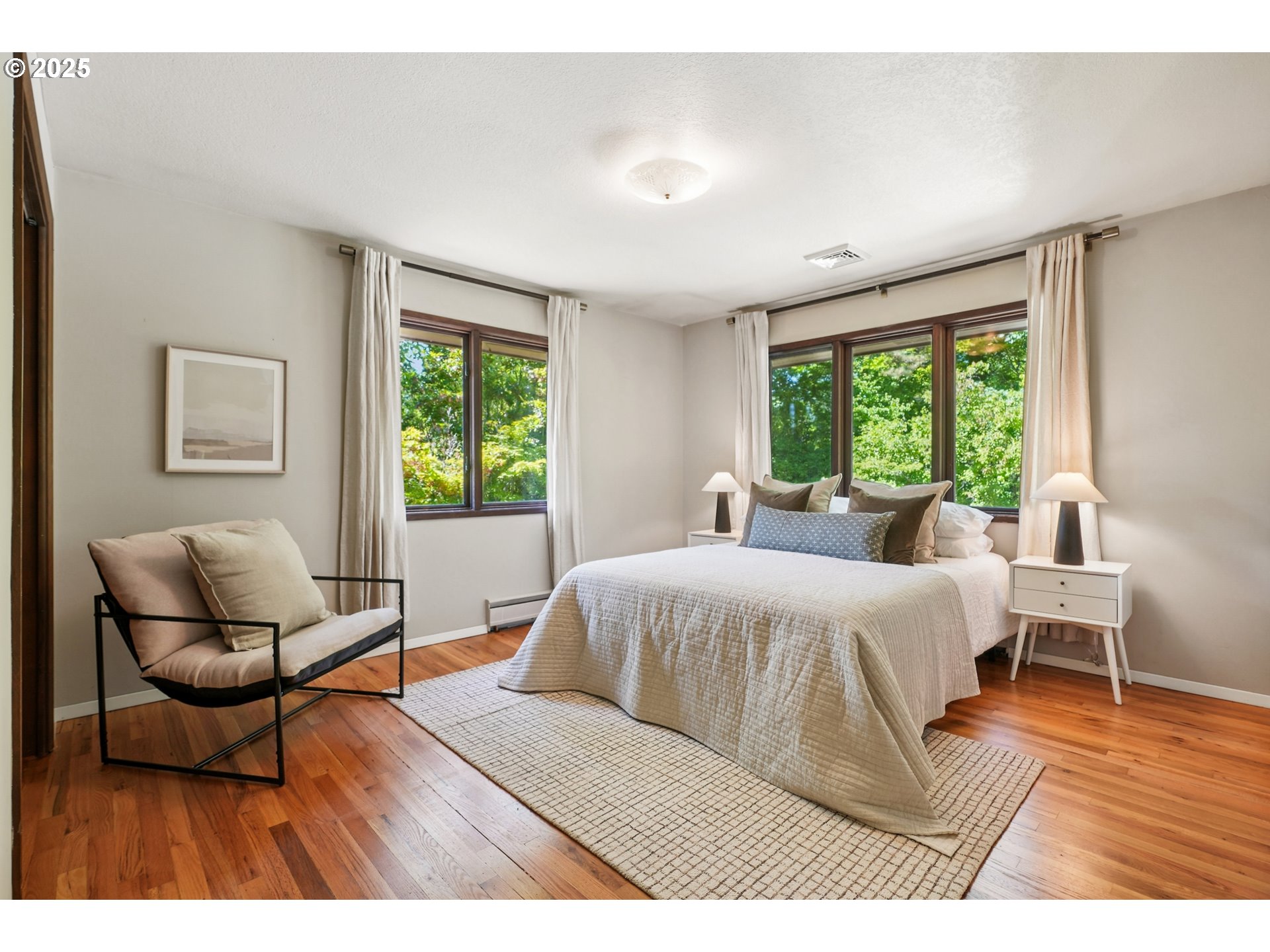 5820 Southwest Miles Court Portland, OR 97219 - Photo 18 of 48 a bedroom with a bed and a chair