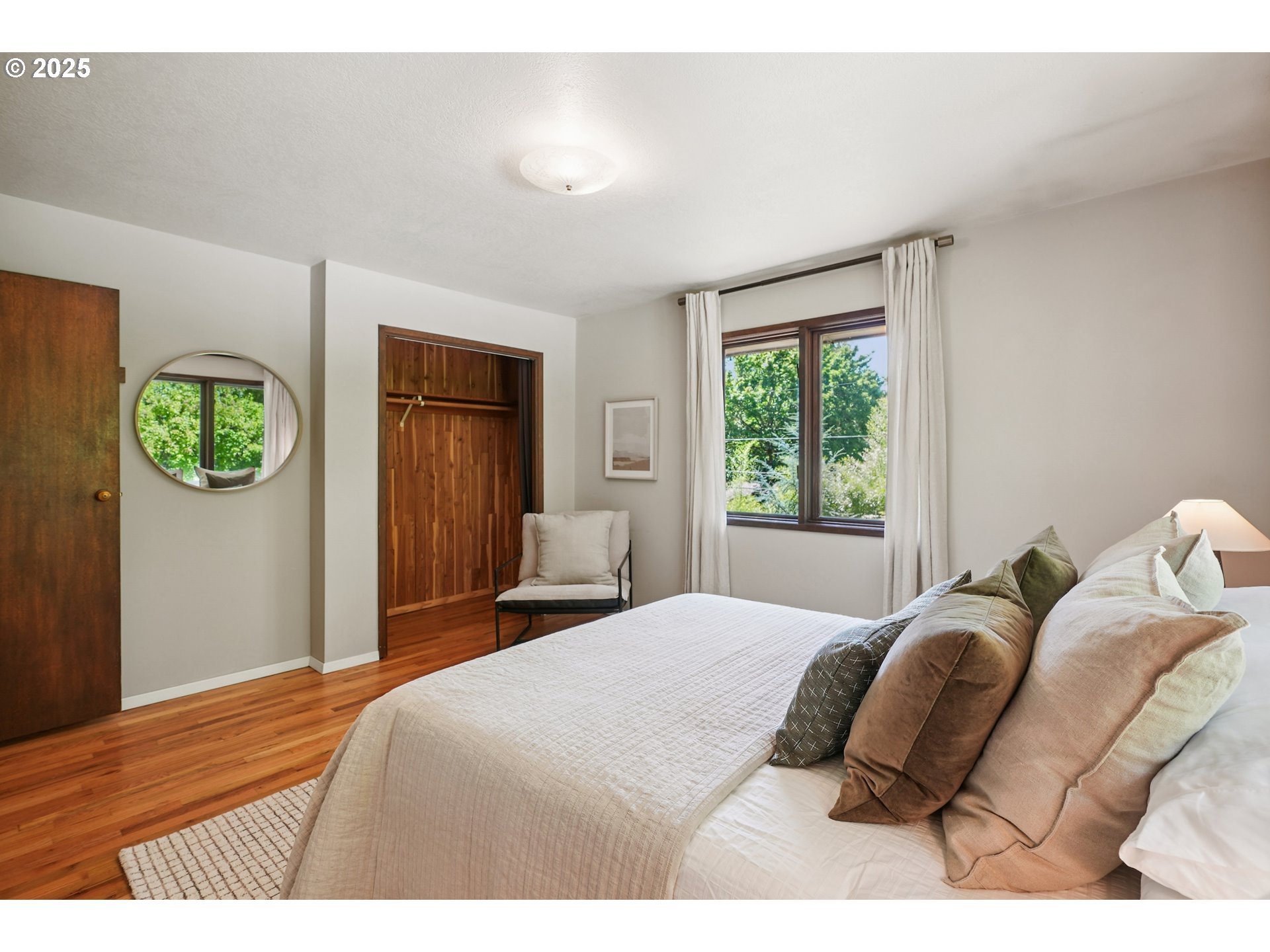 5820 Southwest Miles Court Portland, OR 97219 - Photo 20 of 48 a bedroom with a bed and a window