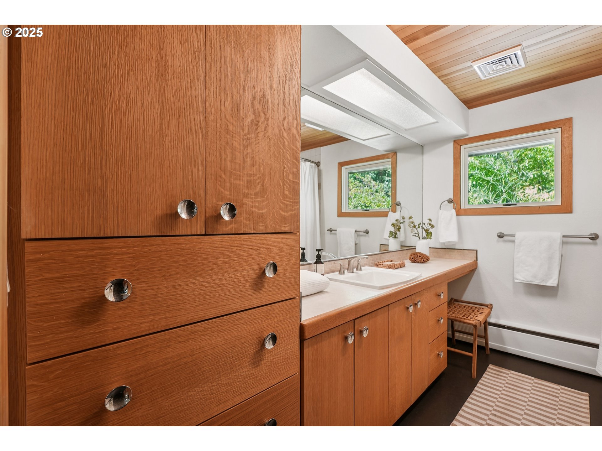 5820 Southwest Miles Court Portland, OR 97219 - Photo 21 of 48 a bathroom with a sink and a mirror