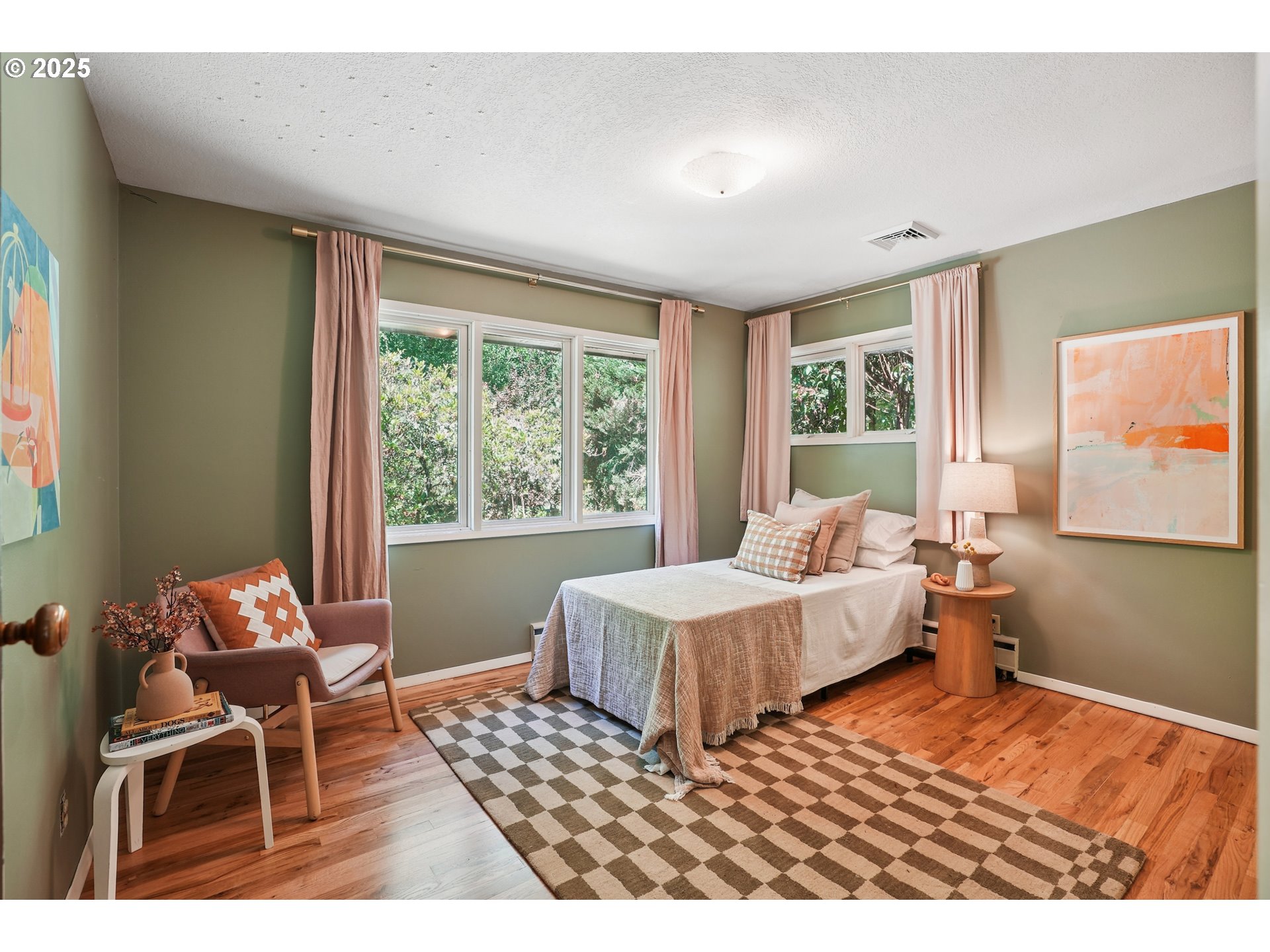 5820 Southwest Miles Court Portland, OR 97219 - Photo 23 of 48 a bedroom with a bed and a window