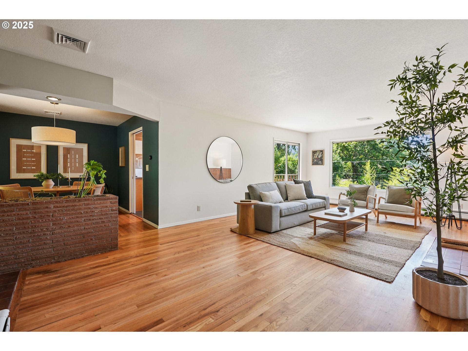 5820 Southwest Miles Court Portland, OR 97219 - Photo 3 of 48 a living room with furniture and a large mirror