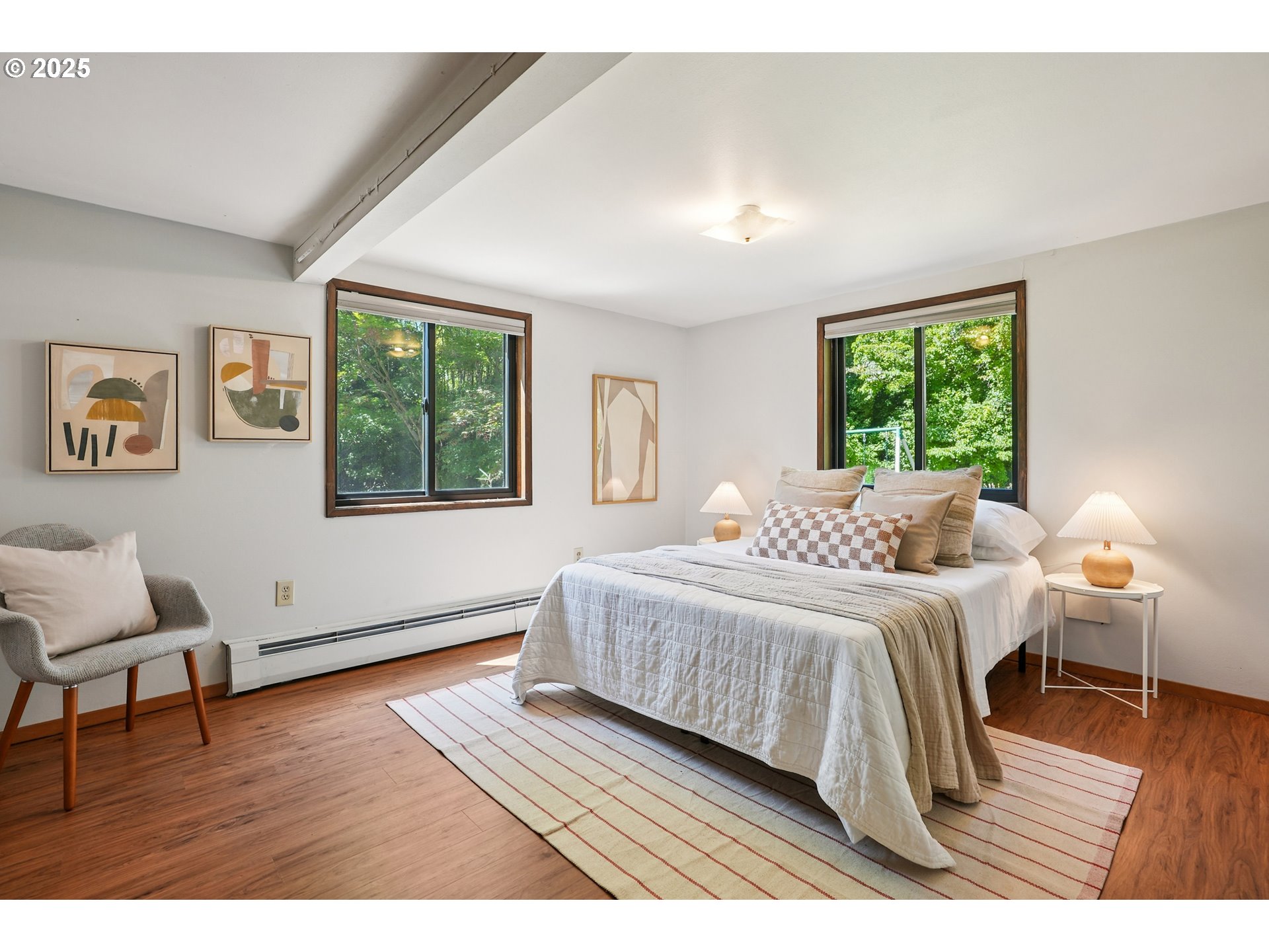 5820 Southwest Miles Court Portland, OR 97219 - Photo 36 of 48 a bedroom with a bed wooden floor and window