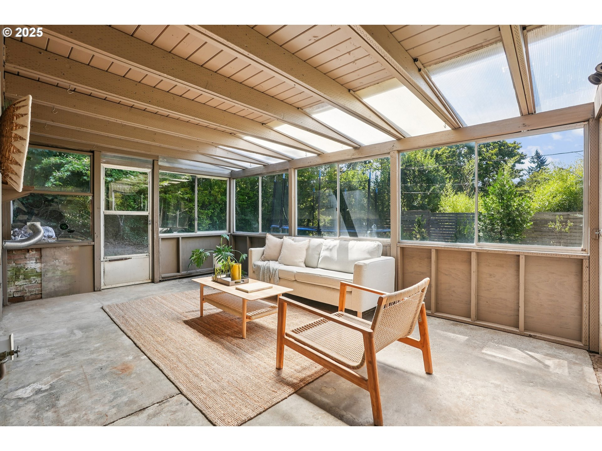 5820 Southwest Miles Court Portland, OR 97219 - Photo 39 of 48 a building outdoor space with patio furniture and potted plants