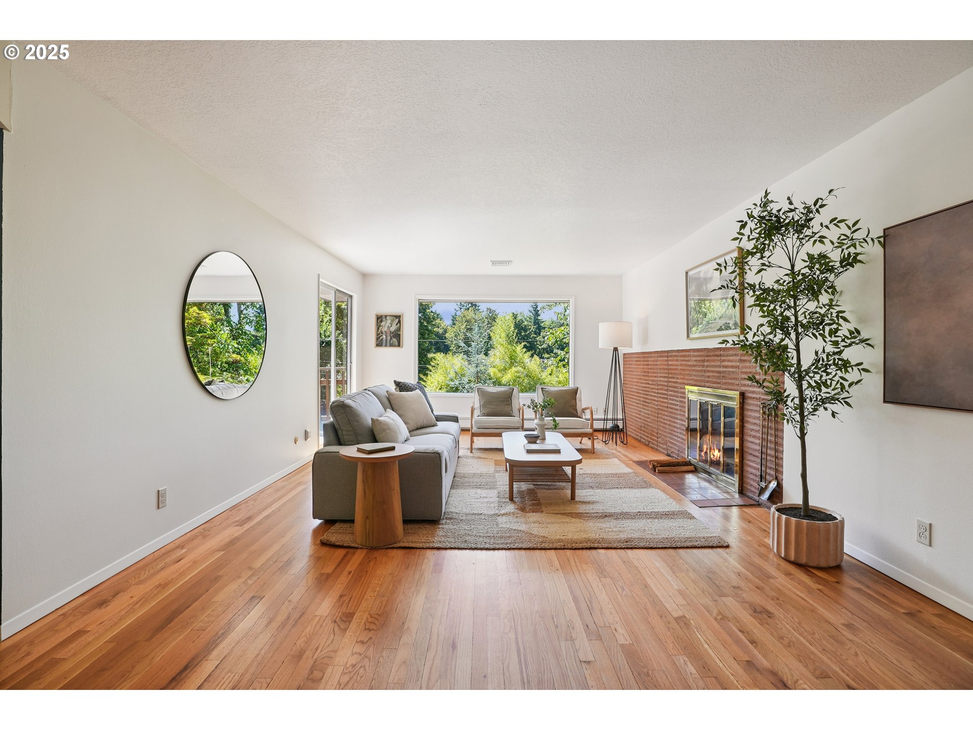 5820 Southwest Miles Court Portland, OR 97219 - Photo 4 of 48 a living room with furniture a window and a potted plant