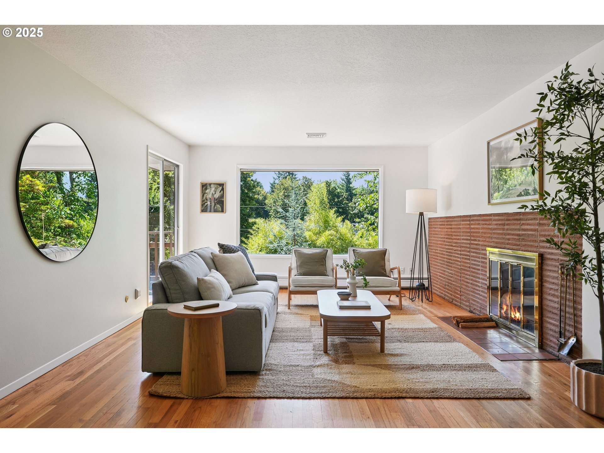 5820 Southwest Miles Court Portland, OR 97219 - Photo 5 of 48 a living room with furniture and a large window