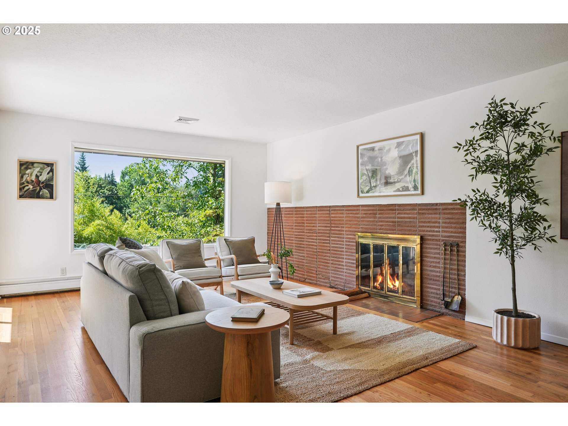 5820 Southwest Miles Court Portland, OR 97219 - Photo 7 of 48 a living room with furniture a window and a fireplace