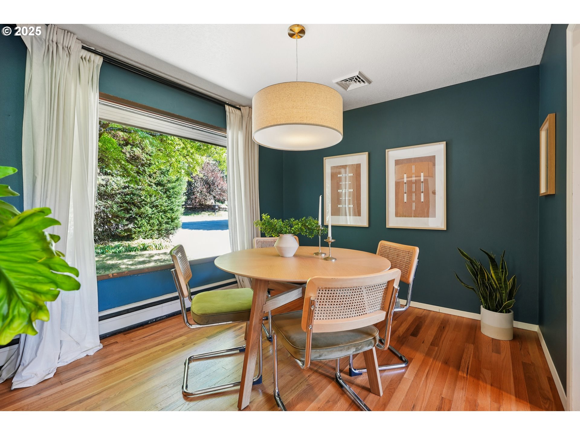 5820 Southwest Miles Court Portland, OR 97219 - Photo 10 of 48 a view of a dining room with furniture window and wooden floor