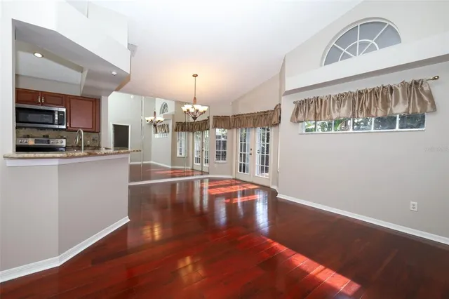 a kitchen with stainless steel appliances granite countertop a stove a sink dishwasher and a refrigerator