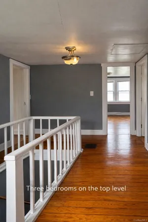 a view of a porch with wooden floor