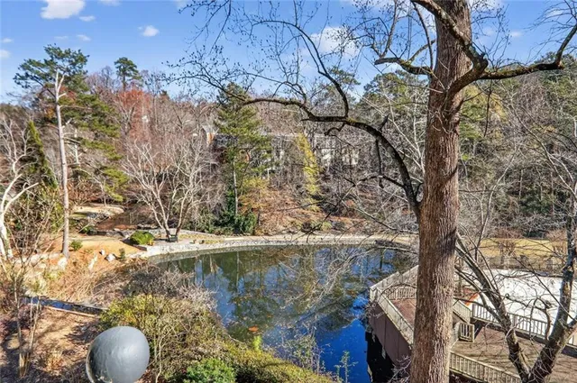 a view of lake from under an umbrella