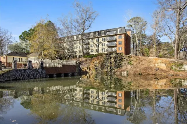 a view of a lake with a building in the background