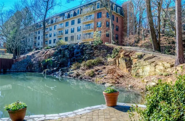 a view of a building with a yard